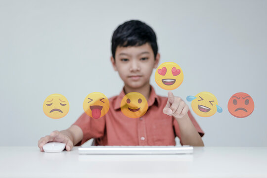 Social media and digital online concept, the children with Social media emoji selection. The concept of living on vacation and playing social media. Social Distancing, Working From Home concept.