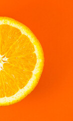 Close up photo of orange texture on the orange background. Fruit cut in half, inside, macro view....