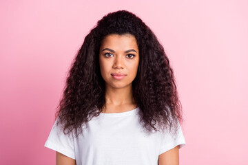 Photo of nice curly hairdo young lady wear white t-shirt isolated on pastel pink color background