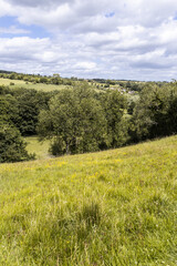 The valley of the River Windrush near the Cotswold village of Naunton, Gloucestershire UK