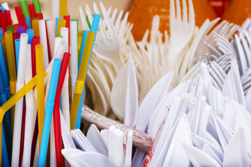 Plastic cutlery . Disposable tableware.Plastic colored cocktail tubes