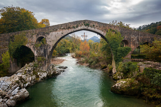 Cangas de Onis historic medieval Roman bridge over the Sella River in Picos de Europa National Park, Asturias, Spain