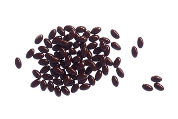 Brown fish oil capsules, vitamins isolated on a white background. Pile of fish oil in gelatin capsules.