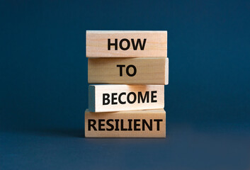 How to become resilient symbol. Concept words 'How to become resilient' on wooden blocks on a beautiful grey background. Businessman hand. Business, How to become resilient concept.