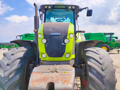 Kyiv, Ukraine - June 16, 2021 : New tractor CLAAS Axion 950 at Kyiv, Ukraine on June 16, 2021.