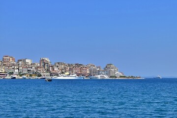 Fototapeta premium View of the city of the sea. Seascape of mediterranean city with yachts and boats at the pier