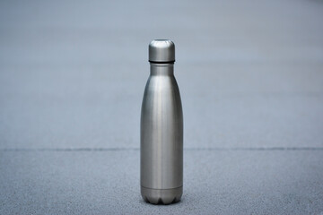 Stainless thermos water bottle. Silver color. Copy space. Zero waste, no plastic. Reusable water bottle. Stainless steel reusable water bottle.