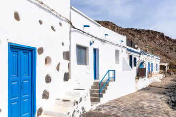 Traditional buildings facing the beach at Pozo Negro on the east coast of the Canary Island of...