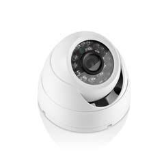 Downward three-quarter view of round white indoor surveilance camera with led lights on white...
