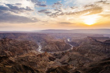 Fototapeta na wymiar Sunset over the Fish River Canyon in Namibia, the second largest canyon in the world and the largest in Africa. 