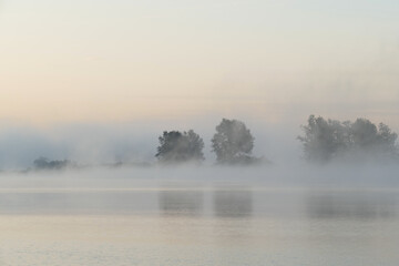 foggy sunrise at a lake