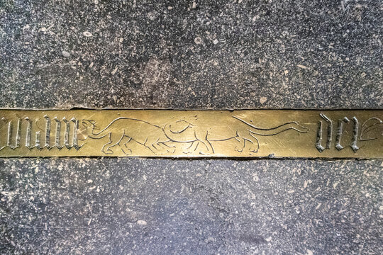 Two Sauropod dinosaurs depicted on the memorial brass to Bishop Bell (died 1496) in Carlisle Cathedral, Cumbria UK