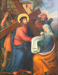 Obraz na płótnie Canvas VIENNA, AUSTIRA - JUNI 17, 2021: The painting Veronica wipes the face of Jesus as part of Cross way stations in church Rochuskirche by unknown artist.