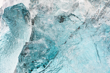 large blocks of clear blue ice with reflections