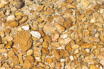 Different stones underwater. Abstract background.