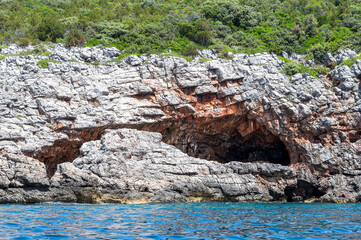 Cave in the rocks above the sea.