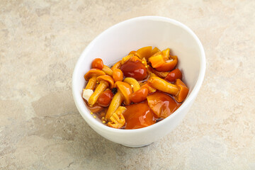 Marinated pickled honey mushrooms in the bowl