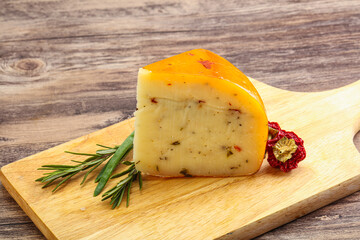Hard cheese with dry tomato