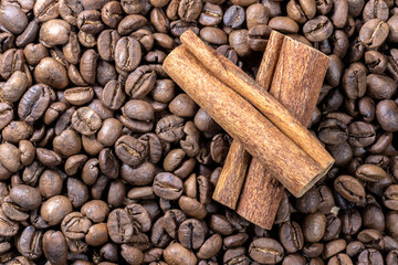 cinnamon sticks on the coffee roasted beans background in Brazil
