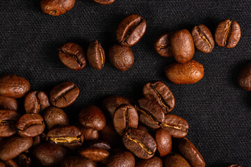 Natural background for Cafe menu or brochure template - macro photo of brown roasted coffee beans, close up