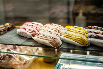 Sweets shop. Fresh macaroni, eclairs, cakes.