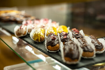 Sweets shop. Fresh macaroni, eclairs, cakes.