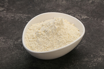 Wheat flour heap in the bowl