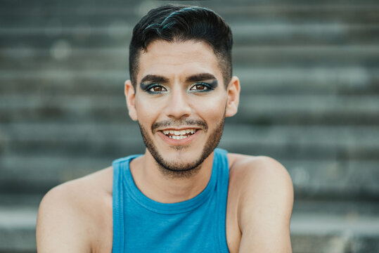 Young Non Binary  Smiling On Camera Outdoor In The City - Focus On Face