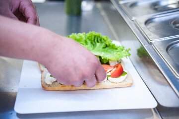 Fresh lettuce with meat and tomatoes for salad or sandwich. Street fast food