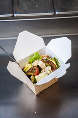 Take away food, noodle box.