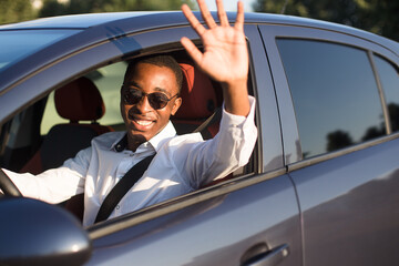 happy african american driving welcomes, in the summer - 447357147