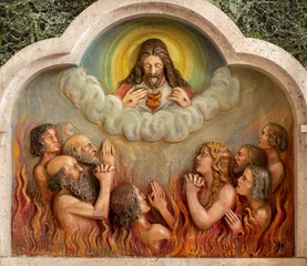  VIENNA, AUSTIRA - JUNI 18, 2021: The relief of Heart of Jesus and the souls in the purgatory in Herz Jesu church from begin of 20. cent. © Renáta Sedmáková