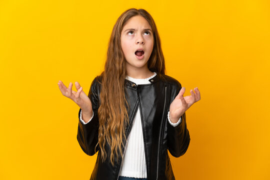 Child over isolated yellow background stressed overwhelmed