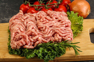 Raw pork minced meat over board