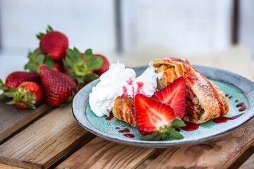 apple dessert with strawberries and whipped cream