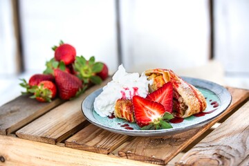 apple dessert with strawberries and whipped cream