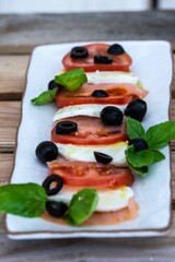 Caprese salad with black olives