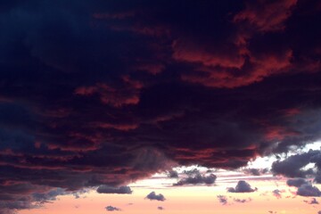Pinkish clouds of a heavy leaden sky