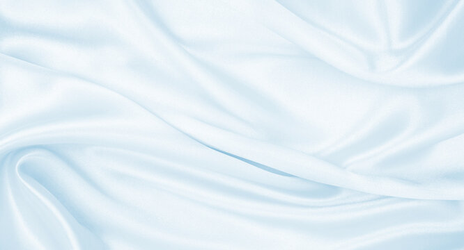 Smooth elegant blue silk or satin luxury cloth texture as abstract background. Luxurious Christmas background or New Year background design © Oxana Morozova