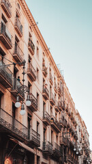 Barcelona, Spain 26-07-2021: a man talks with a girl from their balconies