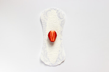 Feminine hygiene panty liner for menstruation. Menstrual cycle, pad. White background. red strawberry.