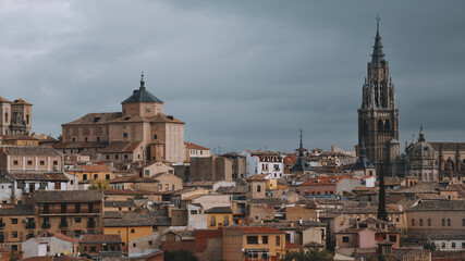 Fototapeta na wymiar Panoramic view of the historic center of Toledo. View of the cathedral, alcazar and city quarters.