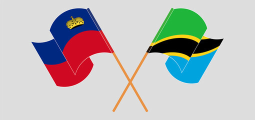 Crossed and waving flags of Liechtenstein and Tanzania