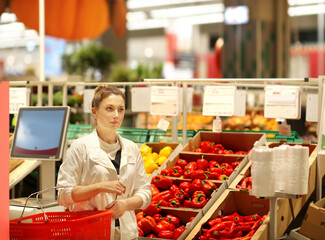 Woman buying fruits and vegetables  at the market