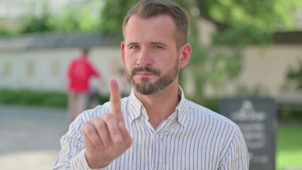 Outdoor Portrait of No Sign by Mature Adult Man by Finger Shake 