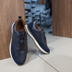 A new dark blue sneakers in a shoes store