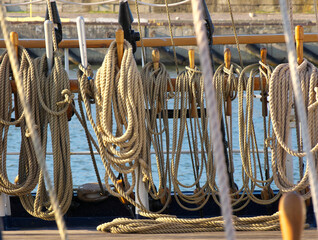 Rigging of a historic sailing ship in the light of the setting sun