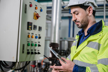 professional technician engineer working to control electrical power and safety service system, electrician working to maintenance and checking industrial equipment in term of factory technology