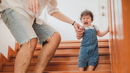 little toddler children with first walk step with stairs at home, small baby person are happy to play and learn to crawling with family, cute infant boy having fun and childhood care