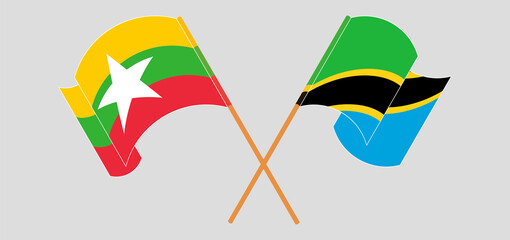 Fototapeta na wymiar Crossed and waving flags of Myanmar and Tanzania
